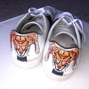 Heavily worn Gucci sneakers